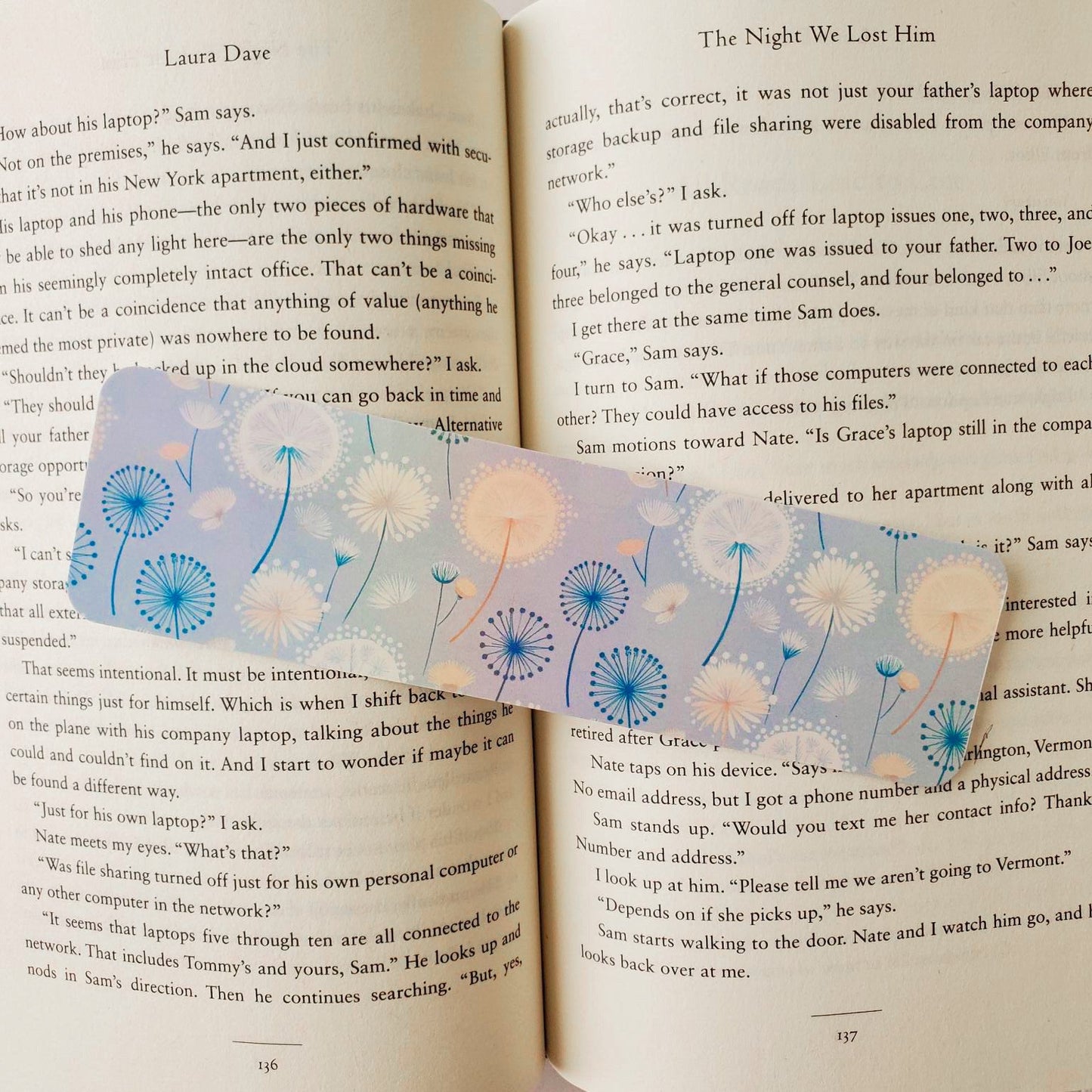 Decorative bookmark with floral design on an open book
