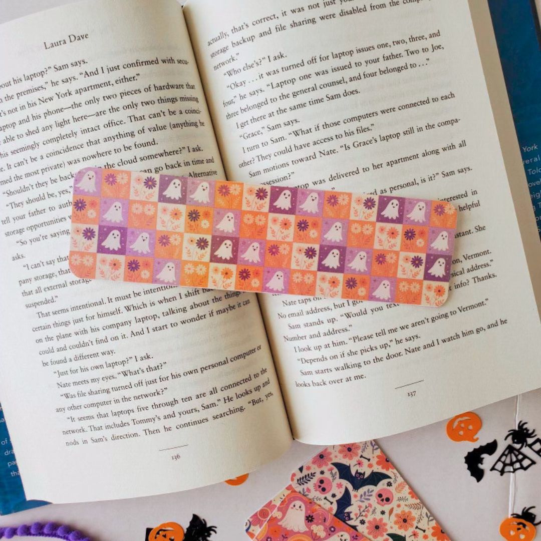 A bundle of aesthetic fall bookmarks with ghost, pumpkin, and witchy illustrations in peach, lavender, and cream tones.