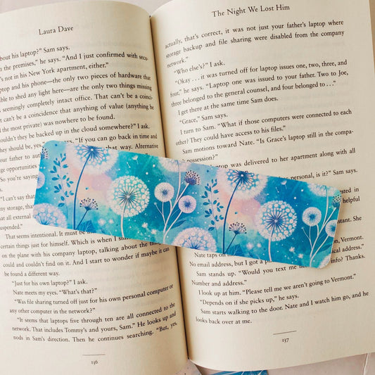 Decorative bookmark with floral design on an open book