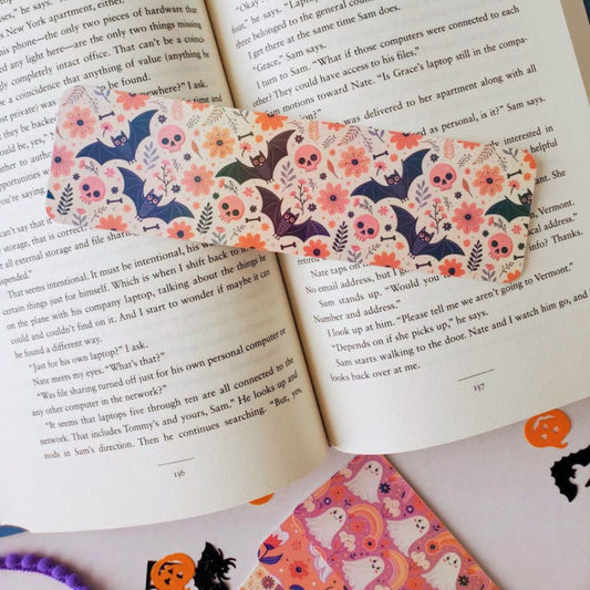 Bundle of spooky-cute bookmarks with playful ghost, pumpkin, and bat illustrations in soft Halloween colors, perfect for autumn reading vibes.